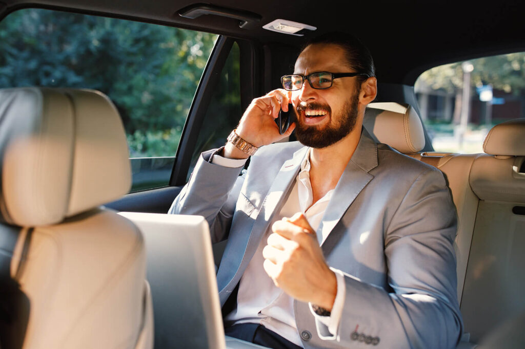 businessman talking on the phone in a taxi 2023 04 06 06 14 51 utc